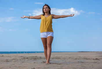 Happy young woman happiness emotion feeling free in summer sun lifestyle background. Joy and freedom concept at the beach..