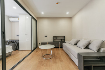 Modern living room and kitchen in small apartment 