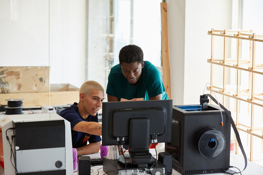 Multiethnic Students Discussing Over Computer