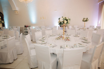 Decorated restaurant on the wedding day. Inside. Interiors