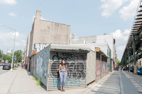 Woman standing on Brooklyn street