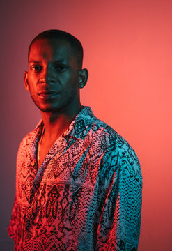 Portrait Of A Man Under Blue And Red Lights