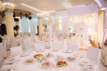 Decorated restaurant on the wedding day. Inside. Interiors