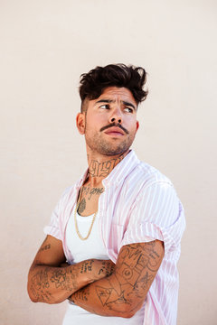 Serious tattooed man with a mustache
