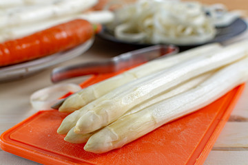 Fototapeta na wymiar New harvest of white asparagus, high quality peeled and washed raw asparagus in spring season, ready to cook