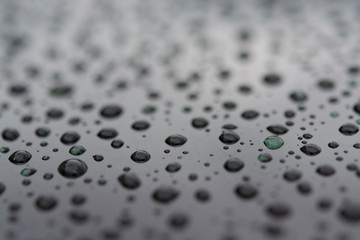 Abstract background with water drops on metal surface
