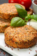 Tasty vegetarian burgers made from healthy quinoa, basil, tomatoes and mozzarella cheese