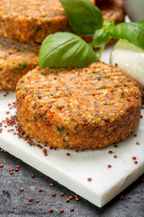 Tasty vegetarian burgers made from healthy quinoa, basil, tomatoes and mozzarella cheese