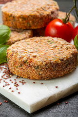 Tasty vegetarian burgers made from healthy quinoa, basil, tomatoes and mozzarella cheese