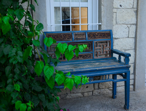 Antique blue wooden bench at outdoor. Vintage bench