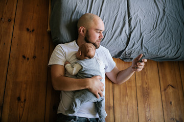 Father lying on floor with son