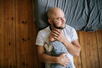 Father sleeping with son