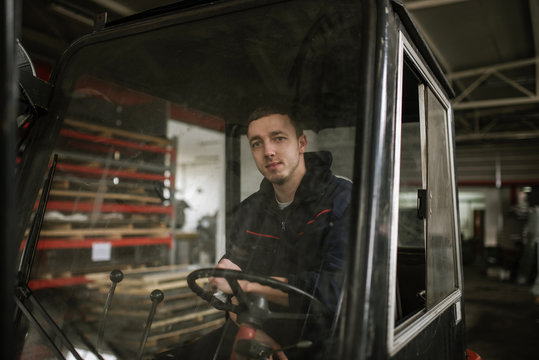 Man operating forklift truck