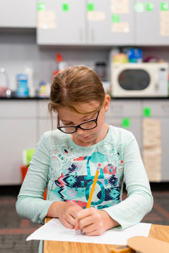 Student at desk in classroom