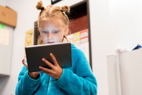 Student researching on classroom tablet