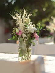 Luxury floral arrangement of pink and white flowers in glass vases. Flowers for wedding decoration
