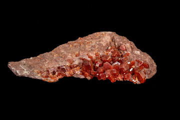 Macro mineral stone Vanadinite on a black background