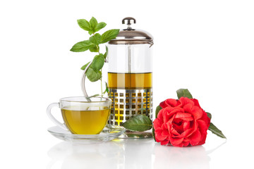 Cup with green tea and green leaves of mint isolated on white background