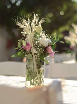 Luxury floral arrangement of pink and white flowers in glass vases. Flowers for wedding decoration