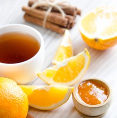 Cup of tea served with orange jam
