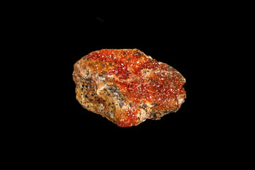 Macro mineral stone Vanadinite on a black background