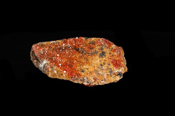 Macro mineral stone Vanadinite on a black background