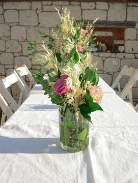 Luxury floral arrangement of pink and white flowers in glass vases. Flowers for wedding decoration