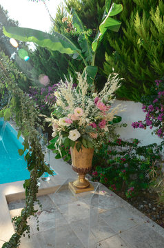 Luxury floral arrangement of pink and white flowers in glass vases. Flowers for wedding decoration