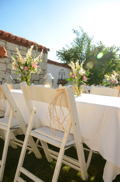 The wedding decor. Table is decorated for event party in the garden