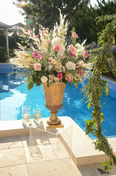 Luxury floral arrangement of pink and white flowers in glass vases. Flowers for wedding decoration