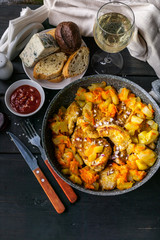 Chicken meat with curry stew with vegetables, cheese, bread and white wine. Top view