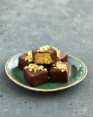 Homemade candy roasted with nuts and caramel. Selective focus