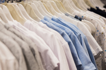 The clothes hanger is Filled with colorful Fabric shirts