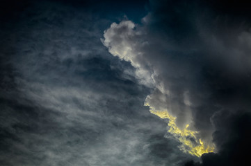 Dramatic  and spooky HDR shot of sunset with various type of clouds filling sky with copy space.
