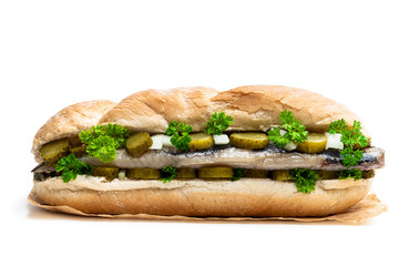 Traditional Dutch sandwich with herring and pickles isolated on white