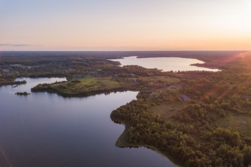 aerial view on two lakes in the countryside at sunset