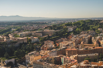 Fototapeta premium Panoramic view of Rome from the top of St Peter's Basilica roof. Famous touristic european attraction. Italy, Europe