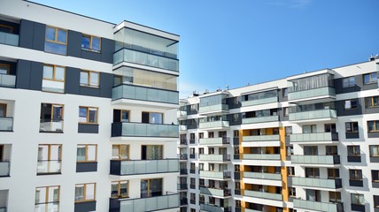 Multistory new modern apartment building. Stylish living block of flats.