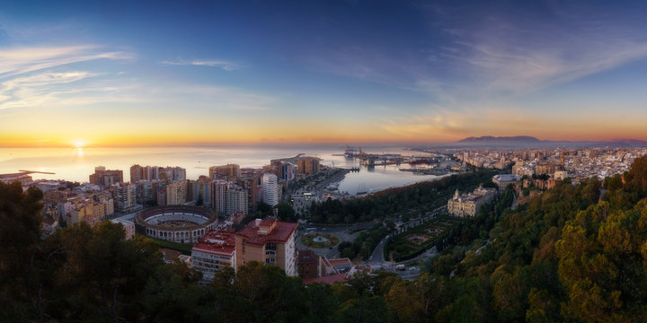 Beautiful panorama from air of cityscape with modern buildings in sunset light.