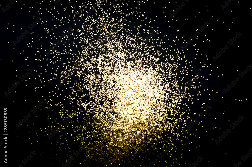 Poster black background with golden sparkles. blurred effect. concept for festive background or for project