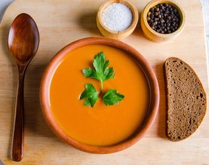 Pumpkin soup served on the table in bowl