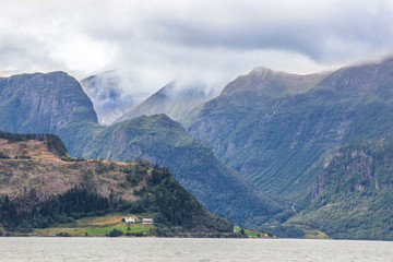 clouds over the fjord and mountains in Norway