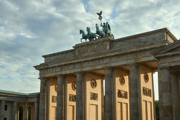 quadriga with the goddess of victory Victoria at the top of the monumental Brandenburg Gate in...