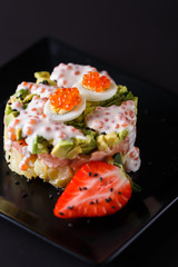 Round salad made of red fish potato and avocado