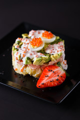Round salad made of red fish potato and avocado