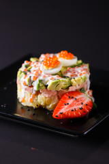 Round salad made of red fish potato and avocado