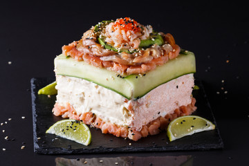 Piece of traditional savory swedish sandwich cake Smorgastorta