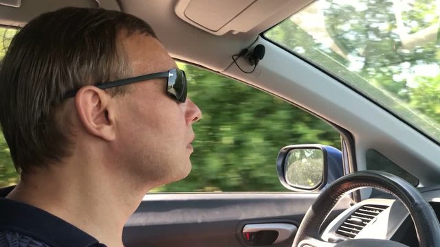 a man drives a car, close-up