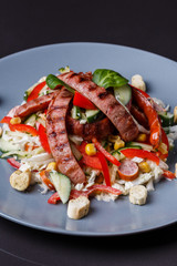 Salad with grilled sausage paprica cucumber and croutons