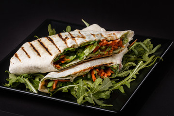Vegetarian delicious pita with arugula and carrots
